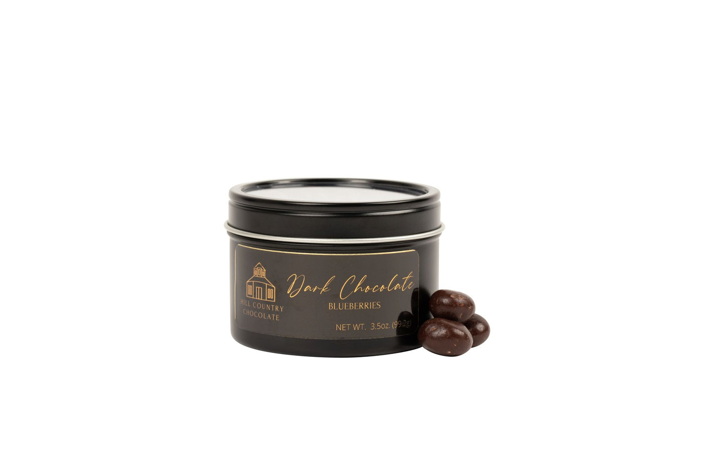 A Hill Country Chocolate of the Month Club tin in a black tin.