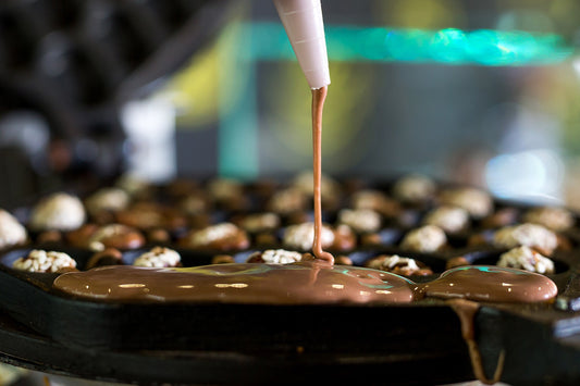 Using Candy Funnels for Precision When Pouring Chocolate and Fillings - Hill Country Chocolate
