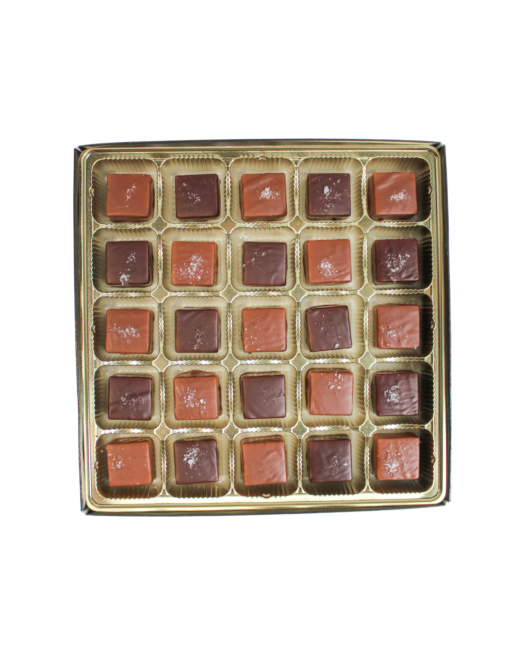 A grid of twenty-five square Hill Country Chocolate Milk & Dark Chocolate Sea Salted Caramels topped with sea salt.