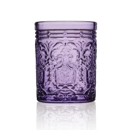 Introducing the Hill Country Chocolate Double Old Fashioned Glass Set: a pair of short, cylindrical, ornate drinking glasses crafted from translucent purple unleaded crystal and photographed against a white background—ideal for elevating any dining experience.