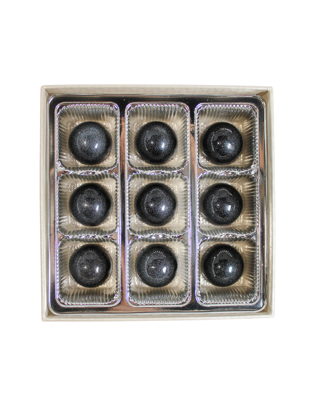 A box of nine spherical, shimmering Coffee with Okinawa Black Sugar Bonbon Collection artisanal bonbons arranged in a grid.