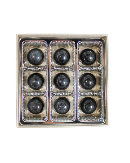 A box of nine spherical, shimmering Coffee with Okinawa Black Sugar Bonbon Collection artisanal bonbons arranged in a grid.