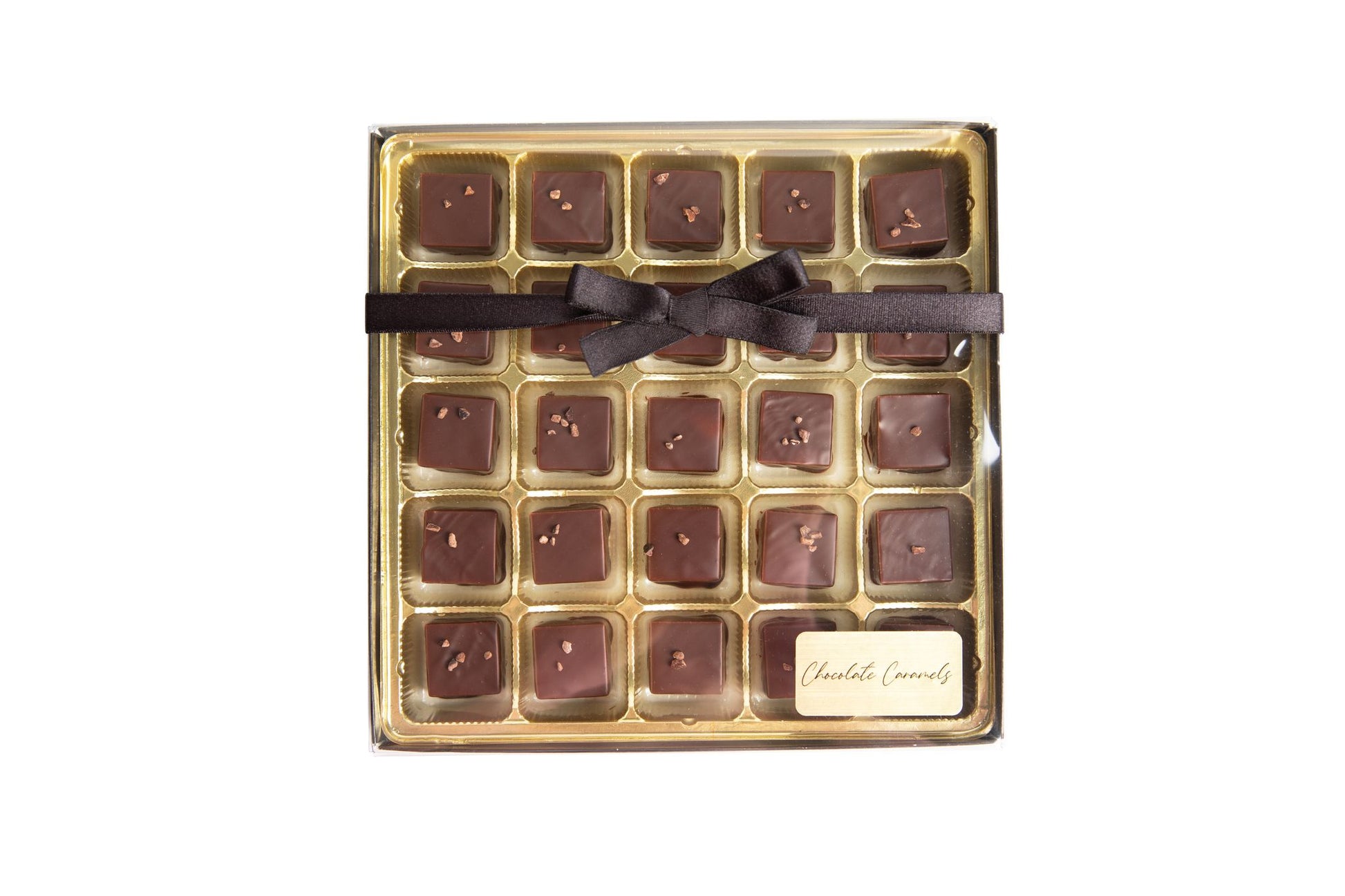 A box of Hill Country Chocolate Dark Chocolate Caramels with a bow on top.