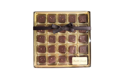 A box of Hill Country Chocolate Dark Chocolate Caramels with a bow on top.