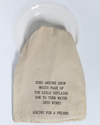 Bring a smile to any kitchen with the Hill Country Chocolate “Does anyone know which page of the Bible...” Tea Towel. This unbleached cotton tea towel features a witty message: “DOES ANYONE KNOW WHICH PAGE OF THE BIBLE EXPLAINS HOW TO TURN WATER INTO WINE? ASKING FOR A FRIEND.” It’s the perfect funny gift or décor for wine lovers and home chefs alike.